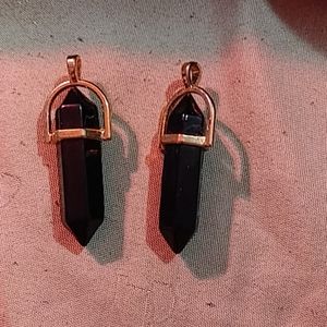 2 black onyx and gold pendants